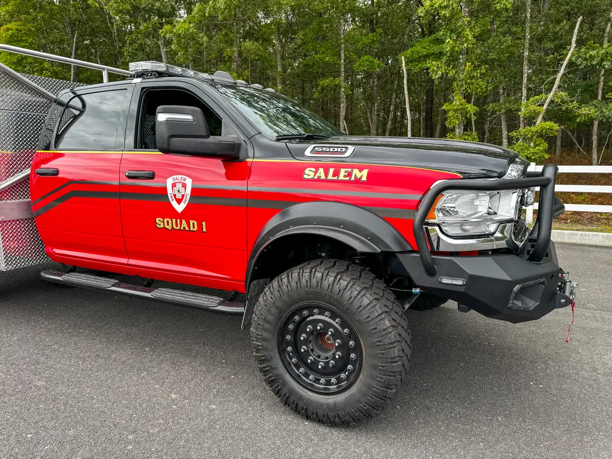 Right-front cab close-up showing door striping and front fender area.